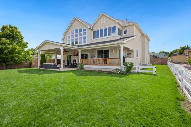 Home 12 Beautiful twostory suburban house with a large green lawn an 1783443846